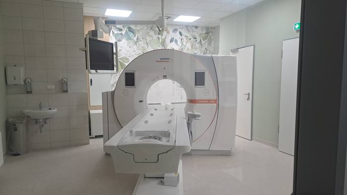 The examination room as completed: the CT scanner with the patient table.